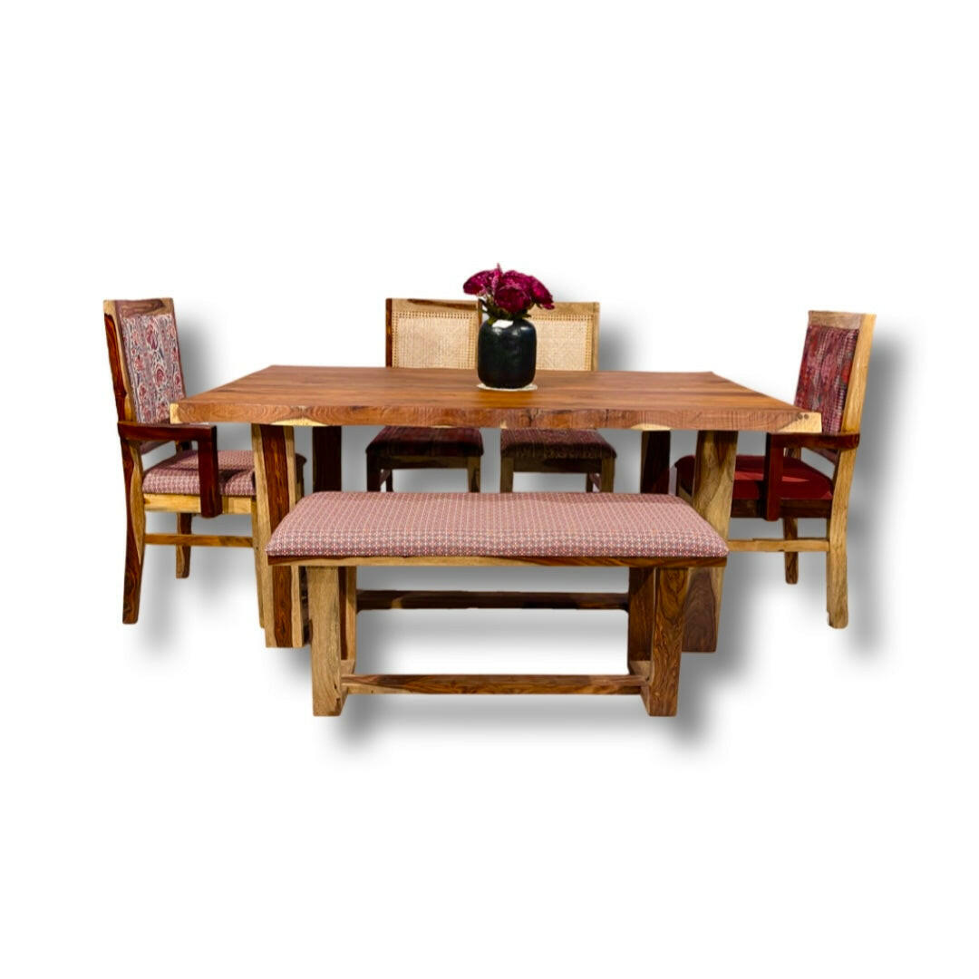 Elevate your dining experience with our exquisite live edge dining table crafted from premium sheesham wood. Accompanied by cane weave chairs & two arms chairs, buy luxury six seater dining table now