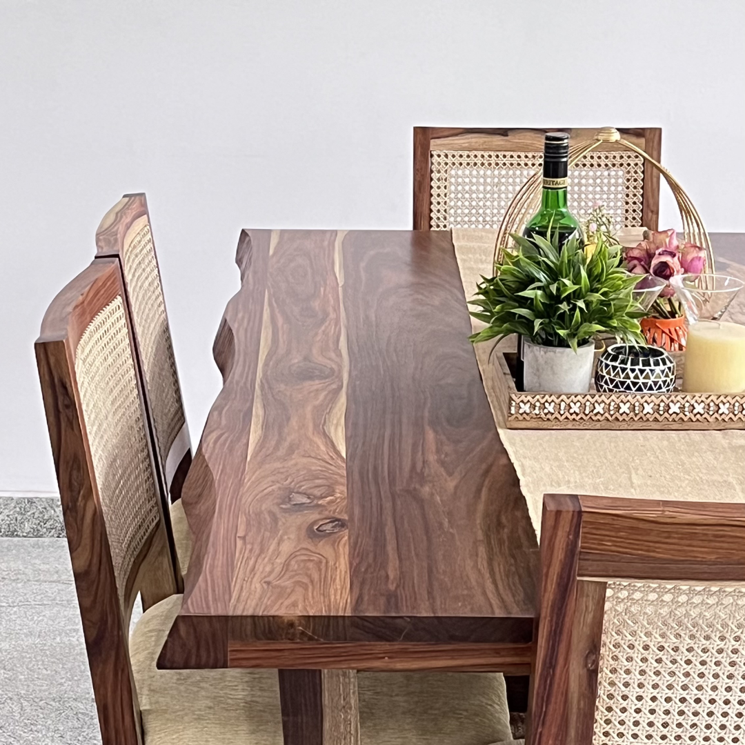 Indulge in a touch of nature's with our live edge dining table with cane weave chairs. Crafted from Sheesham wood, Discover the perfect six-seater dining set to transform your dining room, Shop now!