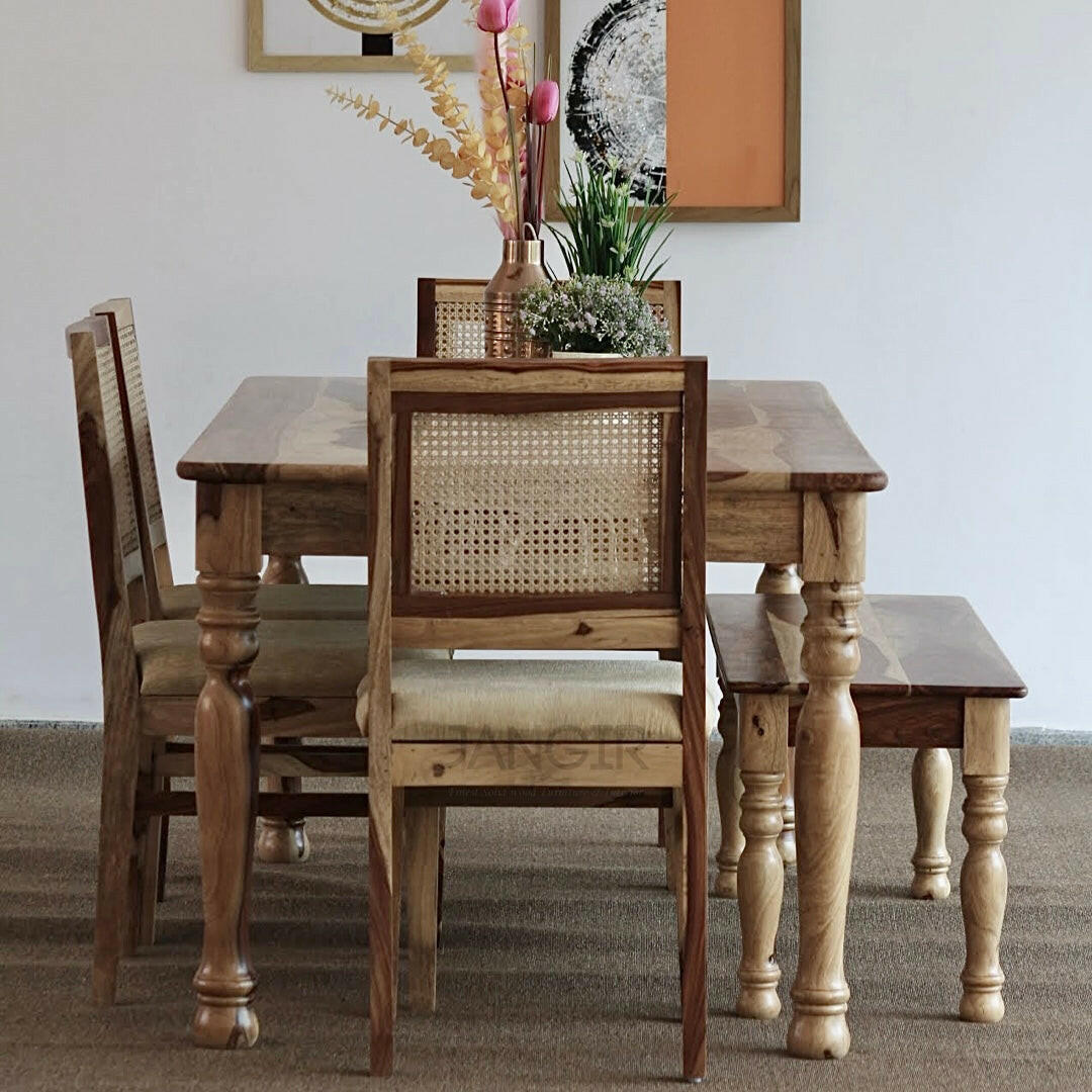 Elevate Your Dining room with our sheesham wood Nar Round Leg Dining Table With Cane Chairs. Buy Rattan-Wicker modern dining tables near you in Bangalore!