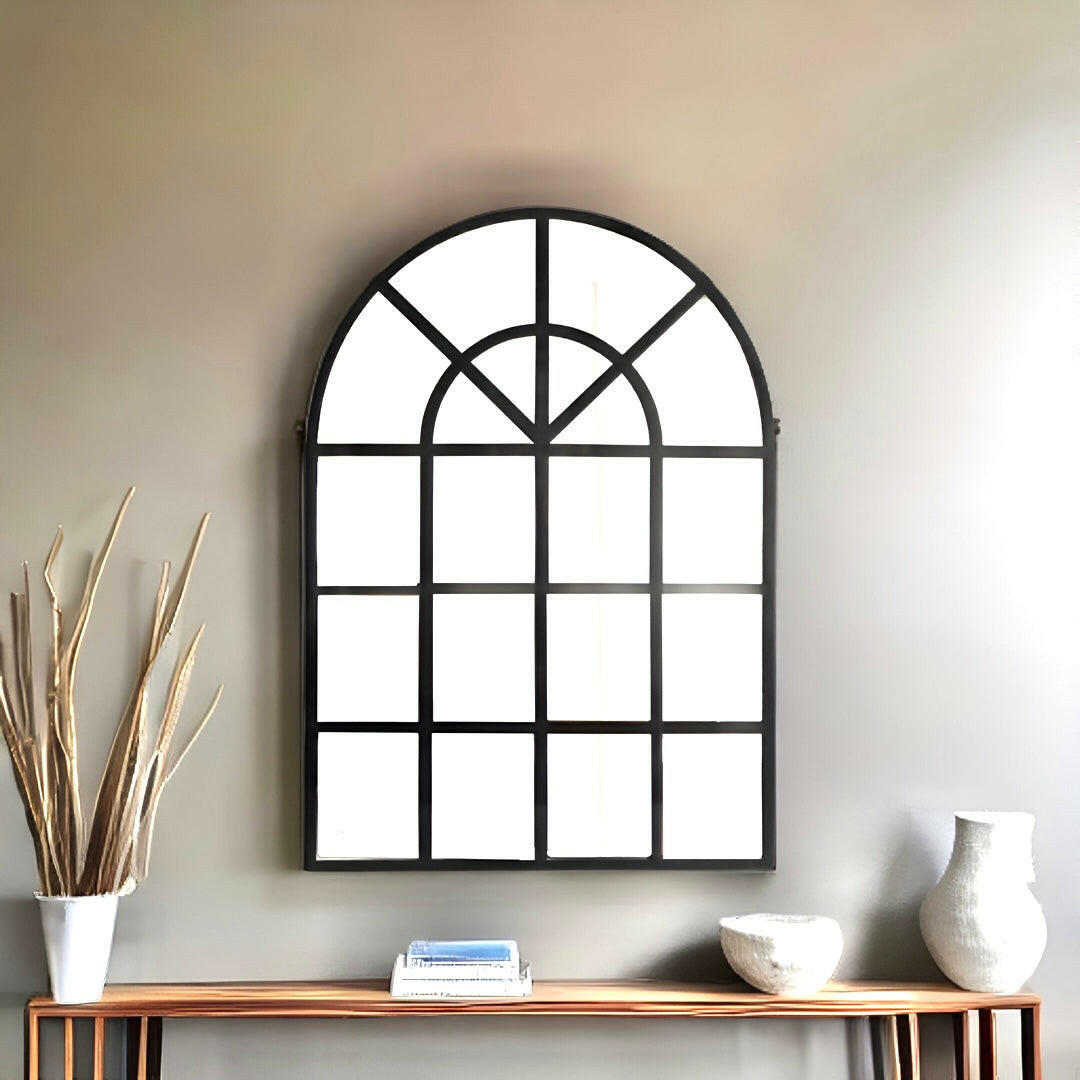 Elevate your home with our exquisite arched wall mirror reminiscent of classic window style. Add a touch of glamour and open up your space with the perfect metal accent for foyer or hallway. Shop now