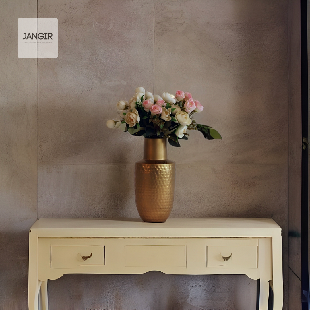 Enhance your living room decor with our exquisite hammered flower vase in a dazzling brass finish, crafted with metal. Buy online now for an elevated home ambience!