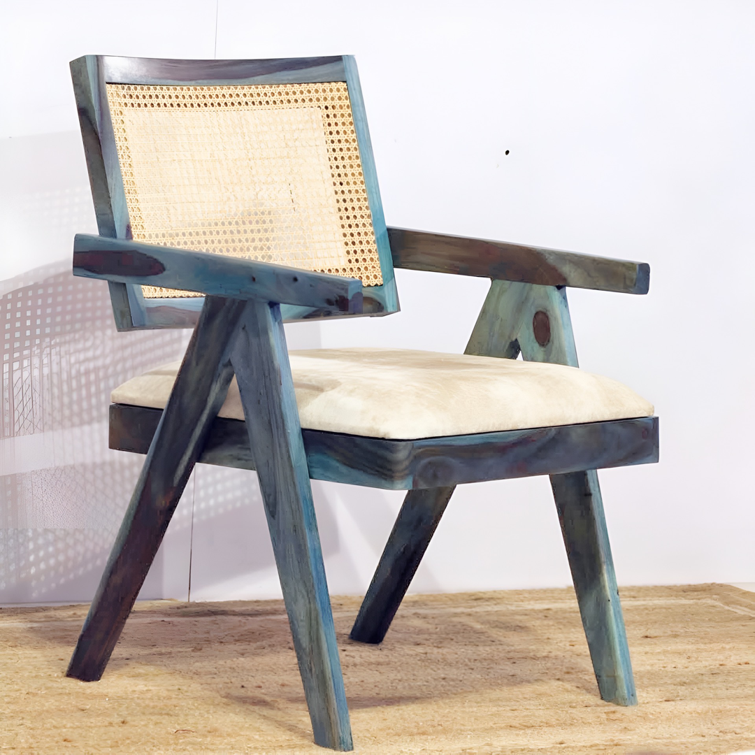 Upgrade your living room with our Blue Stained Wooden Cane Chair. Made with wicker and sheesham wood. Shop now and experience the joy of  comfortable sitting in this cozy wooden armchair.