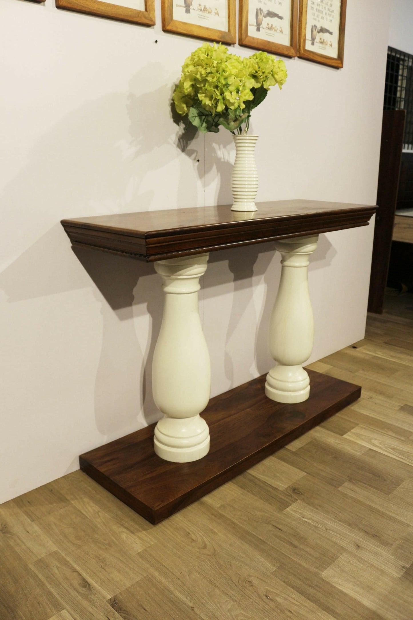 Elevate your living room with our durable and stylish Royal console table, made from sheesham wood with white solid round legs. Add a touch of elegance today!