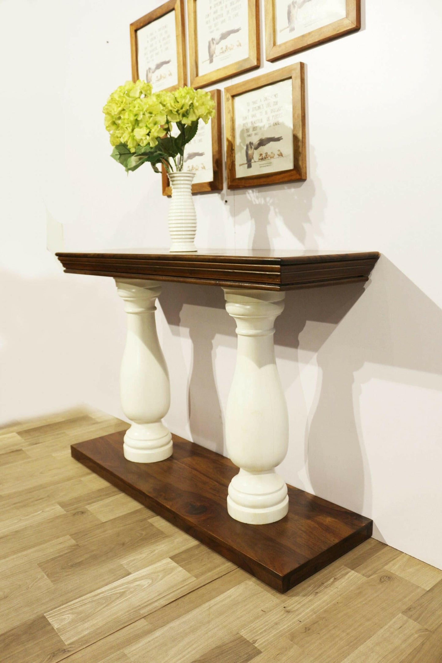 Elevate your living room with our durable and stylish Royal console table, made from sheesham wood with white solid round legs. Add a touch of elegance today!