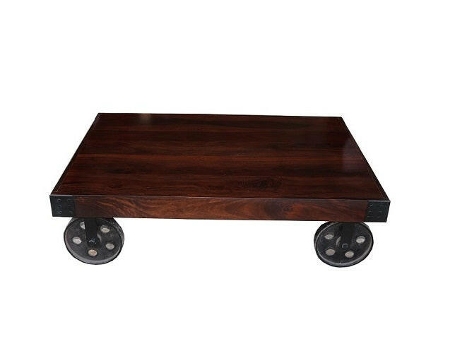 Enhance your living space with our stylish industrial coffee table with wheels, crafted from Sheesham wood and accented by sturdy metal wheel legs. Explore now for a touch of rustic charm!
