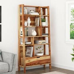 Alta Solid Wood Bookcase with Drawer - the perfect addition to any living room or bedroom! This solid wood book self is both stylish and multi-functional, featuring an eye-catching sheesham wood design and plenty of storage space. It is ideal for your family's library or as a attractive display case for your kid’s favorite books.