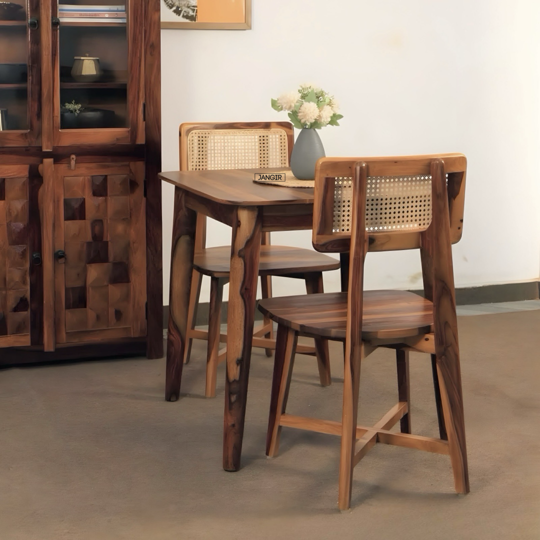 Discover the Aqua Two Seater Dining Set crafted from premium Sheesham wood and natural cane. Perfect for stylish, compact dining spaces—shop now!