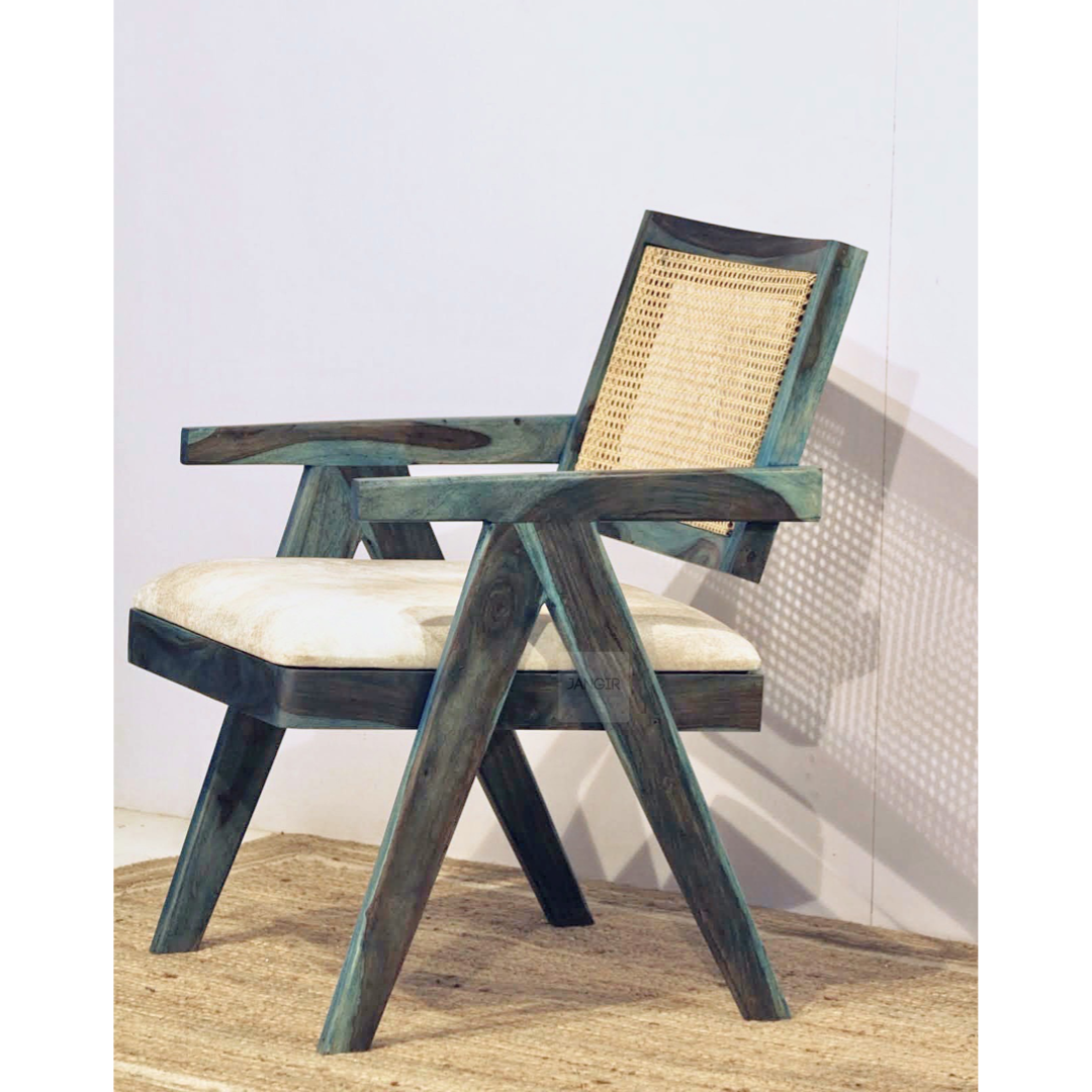 Upgrade your living room with our Blue Stained Wooden Cane Chair. Made with wicker and sheesham wood. Shop now and experience the joy of  comfortable sitting in this cozy wooden armchair.