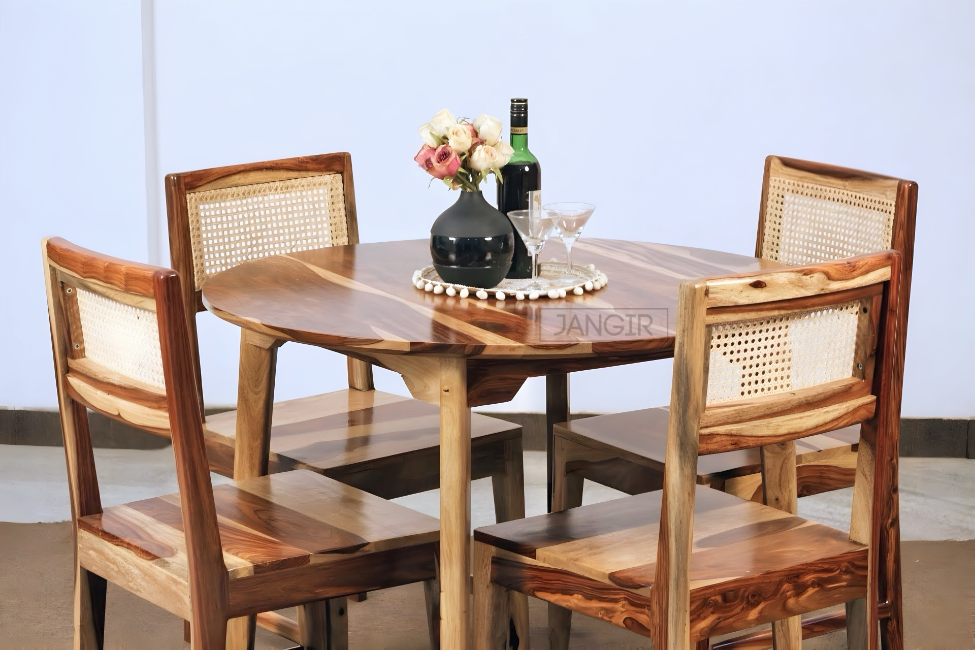 Elevate your dining experience with a modern round dining table set. This four seater dining table with cane chairs crafted from sheesham wood. Explore our dining table collection today !