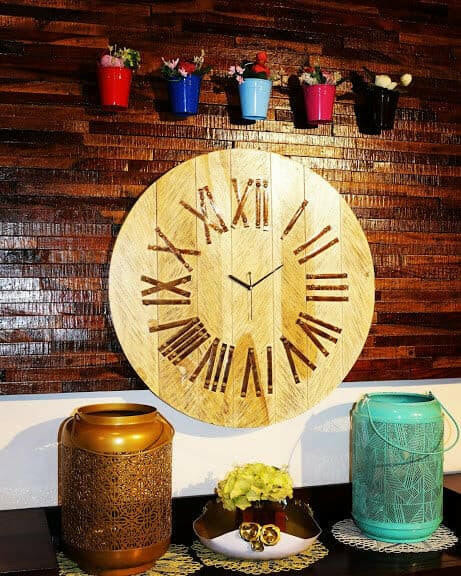 SALUTIYA CARVED WOODEN WALL CLOCK.