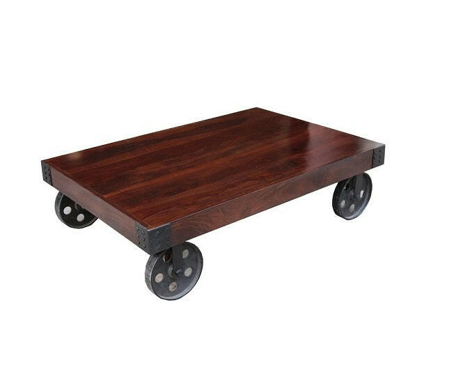 Enhance your living space with our stylish industrial coffee table with wheels, crafted from Sheesham wood and accented by sturdy metal wheel legs. Explore now for a touch of rustic charm!