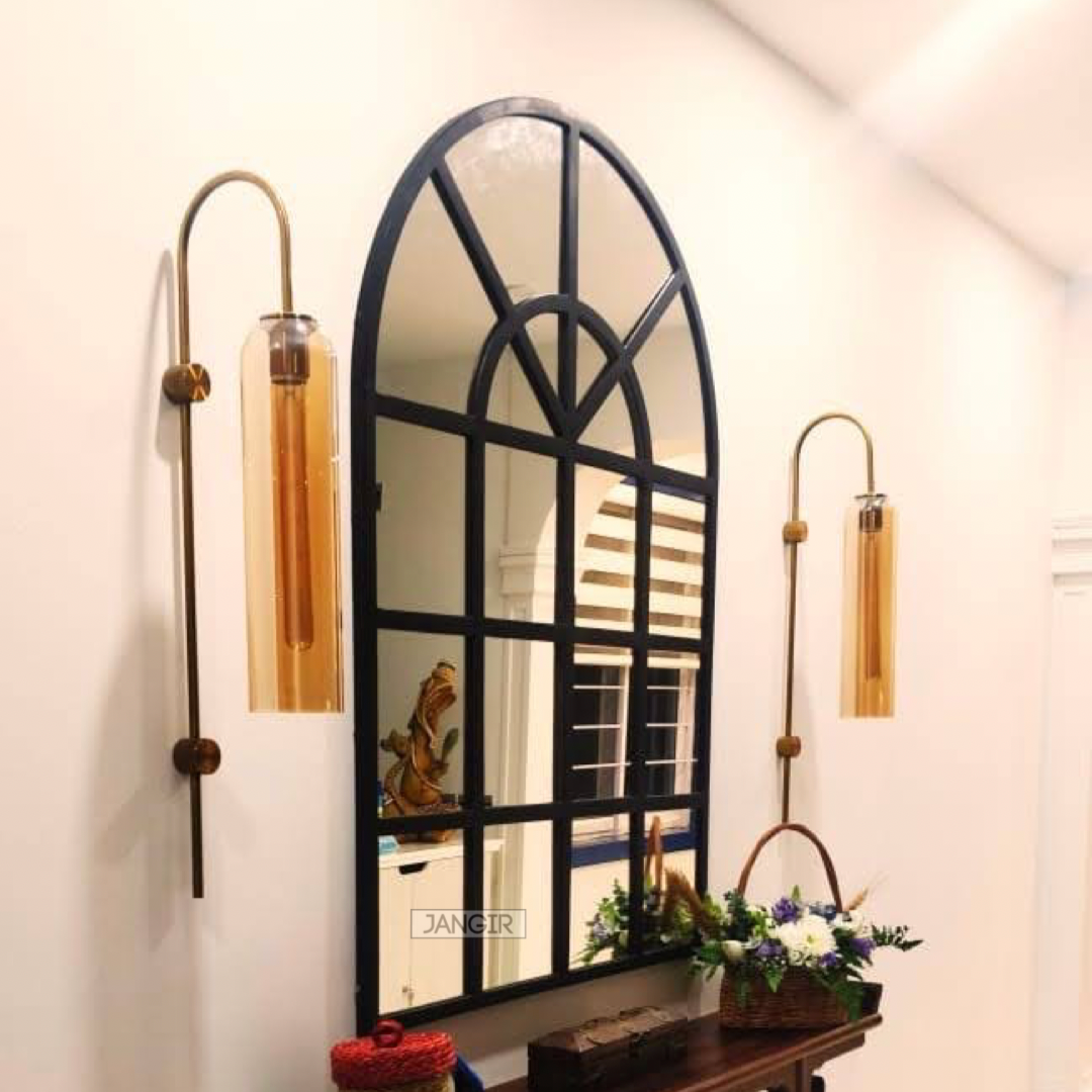 Elevate your home with our exquisite arched wall mirror reminiscent of classic window style. Add a touch of glamour and open up your space with the perfect metal accent for foyer or hallway. Shop now