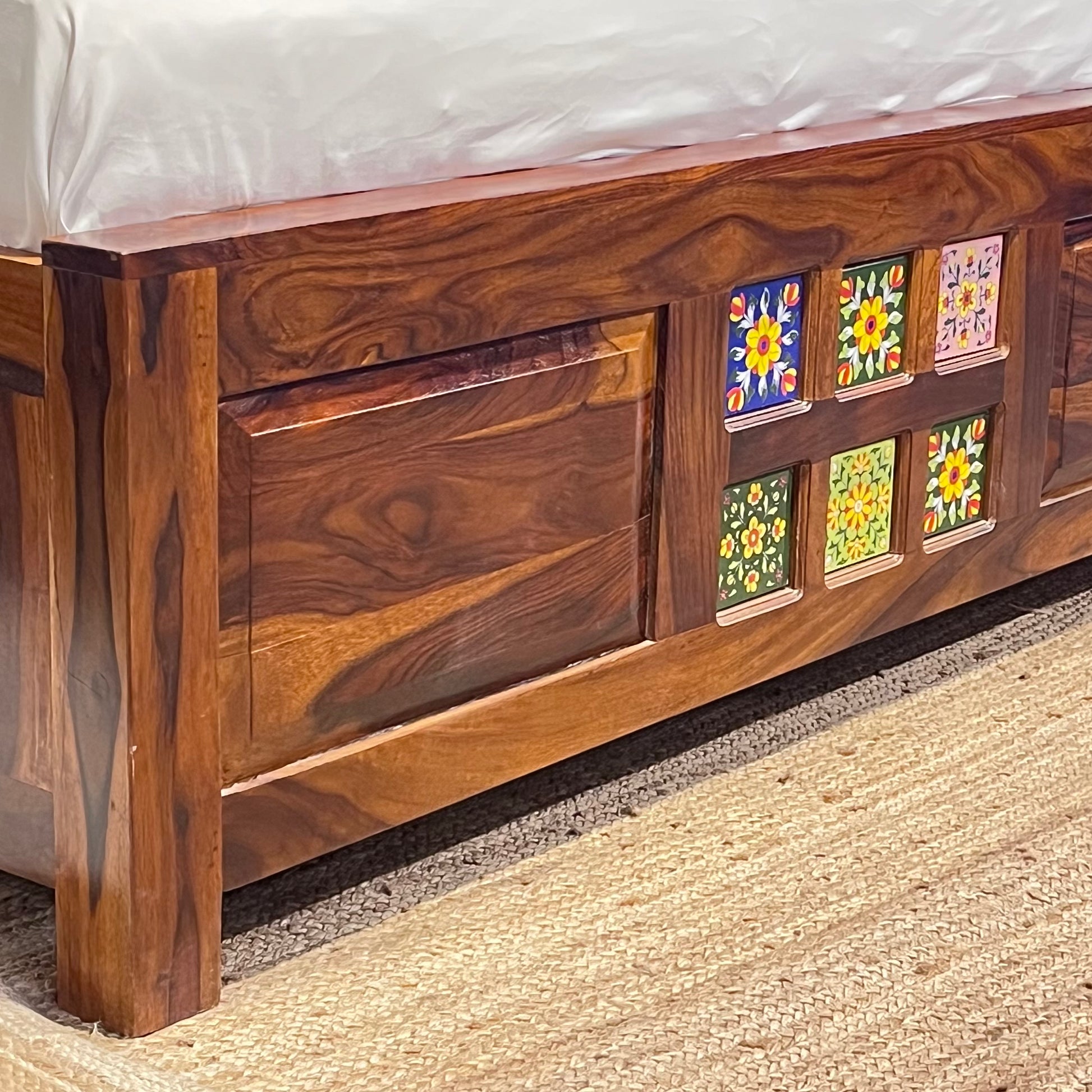 "Transform your bedroom with our exquisite collection of Tiles Plane Solid Wood Storage Bed, with traditional Rajasthani tile designs while experiencing true comfort in king or queen size variants.