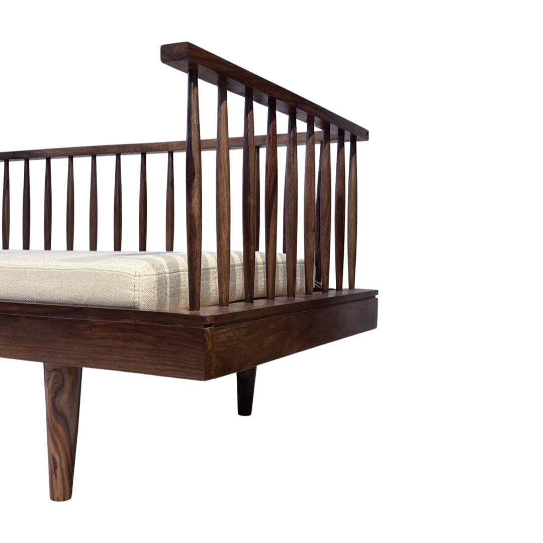 Grills Daybed! This wooden daybed is the perfect addition to any living space. Crafted from solid shessham wood, this designer daybed delivers no-nonsense charm and style with its mid-century inspired design. Its traditional rectangular shape with subtle arched sides adds a touch of finesse and elegance to any room.